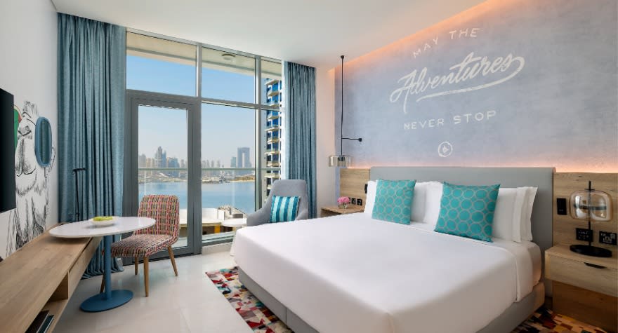 Comfortable bedroom of the premium sea view room at NH Collection Dubai The Palm