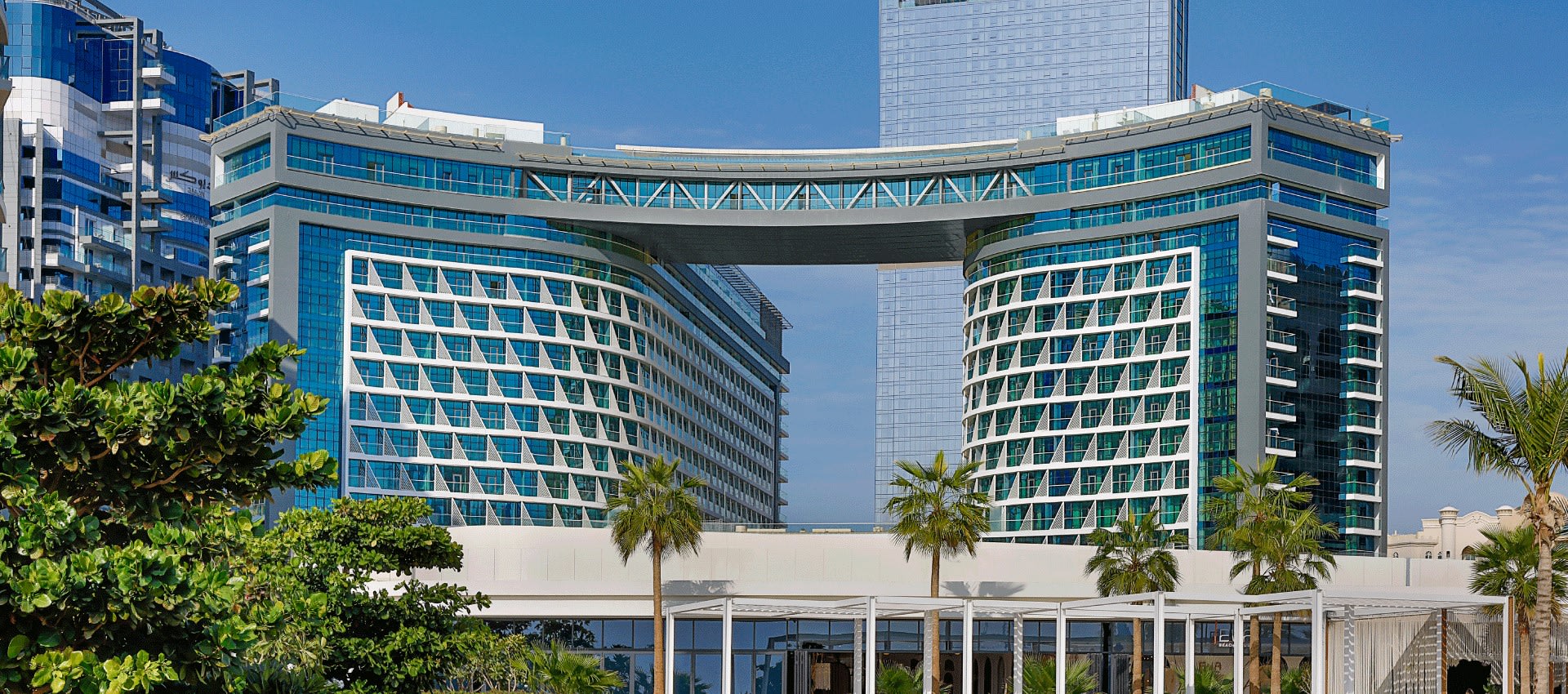 Dubai Hotel| NH Collection Dubai The Palm Hotel Exterior Surrounded by greenery 