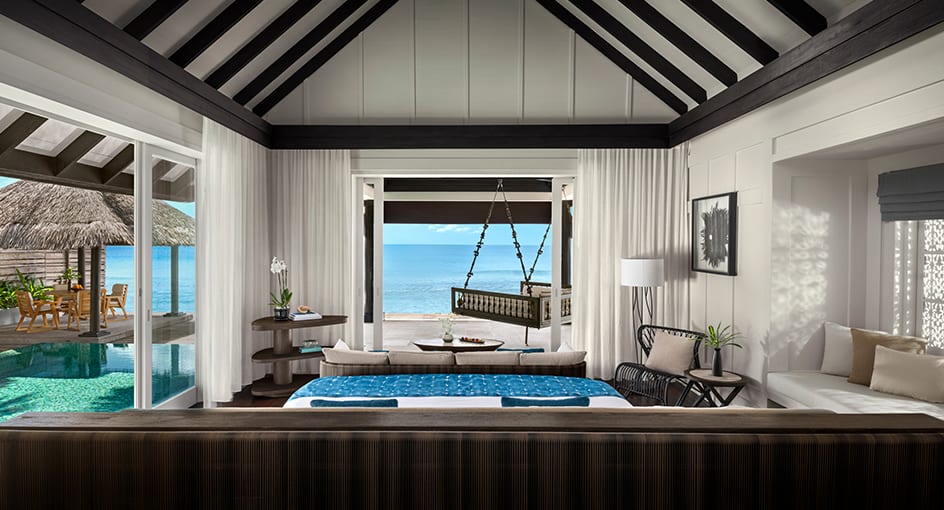Luxury ocean house bedroom with panoramic sea view at Naladhu Private Island Maldives.