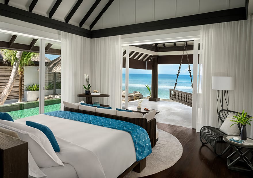 Luxury ocean house bedroom with panoramic sea view at Naladhu Private Island Maldives.