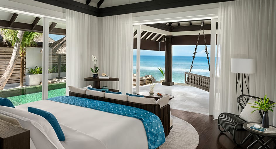 Luxury ocean house bedroom with panoramic sea view at Naladhu Private Island Maldives.