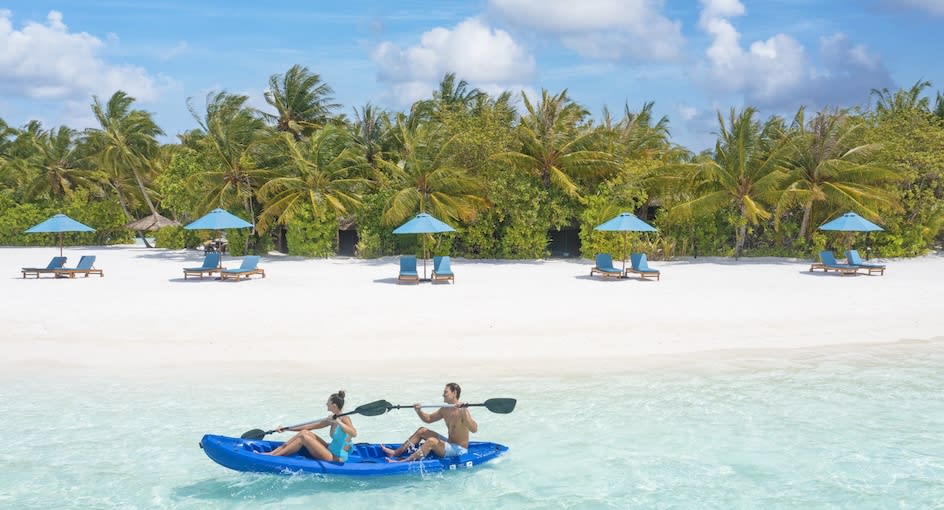 Couple is kayaking at Naladhu Maldives