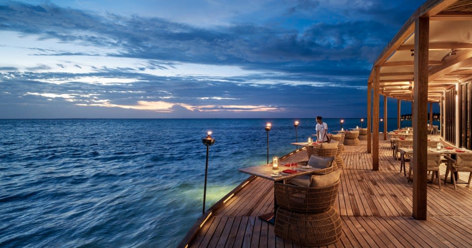 Evening view from Sea Fire Saly, al fresco seafood restaurant at Anantara Dhigu Maldives Resort