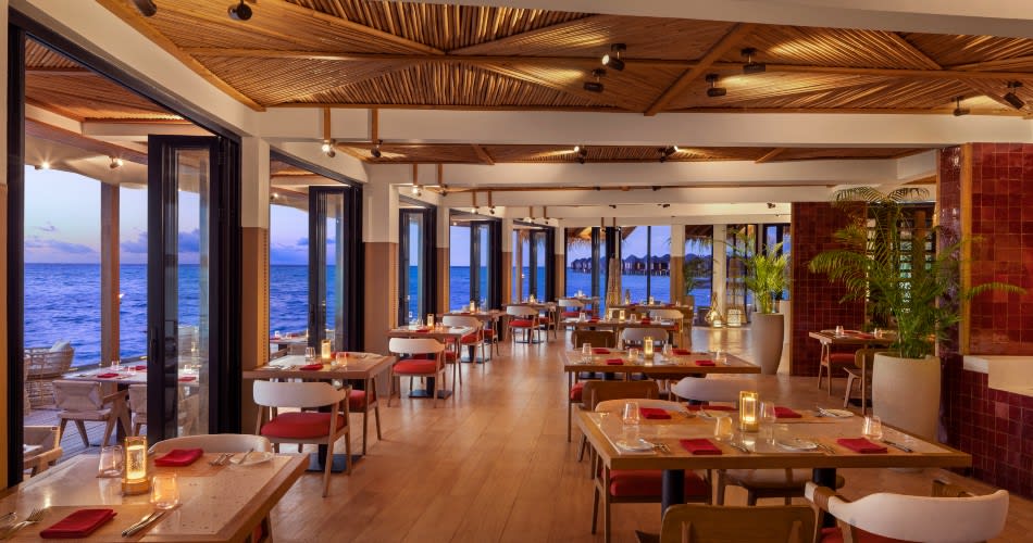 Evening Interior View of Sea Fire Salt, al fresco seafood restaurant at Anantara Dhigu Maldives Resort