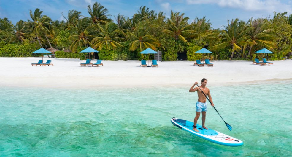 Watersports paddleboarding experience available for guests of Anantara Dhigu Maldives Resort, Anantara Veli Maldives Resort and Naladhu Private Island Maldives Resort