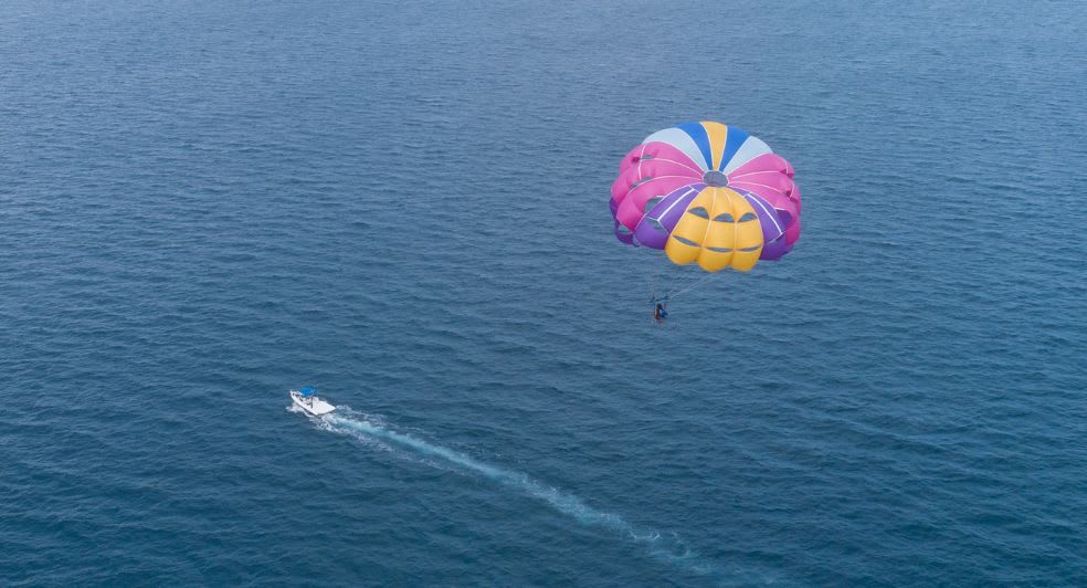 Watersports parasailing experience available for guests of Anantara Dhigu Maldives Resort, Anantara Veli Maldives Resort and Naladhu Private Island Maldives Resort