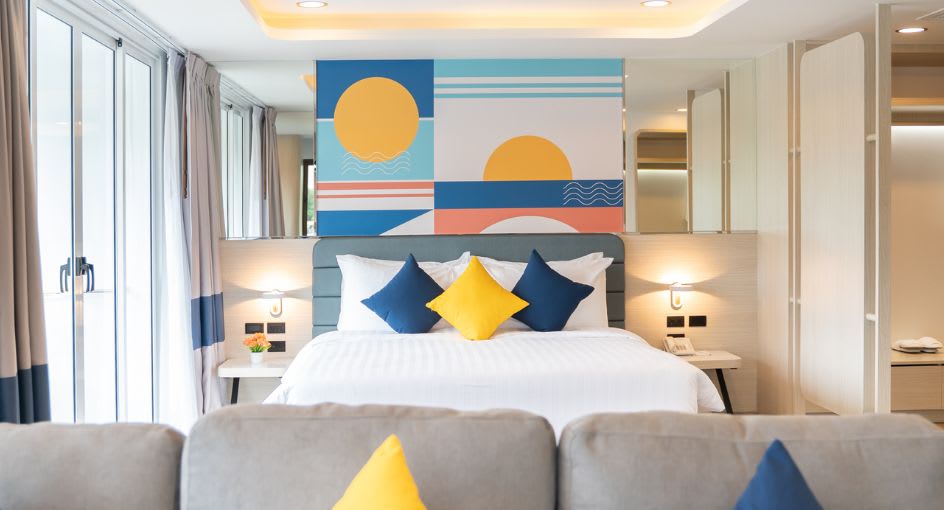 Stylish hotel room at NH Boat Lagoon Phuket featuring modern design and soft furnishings