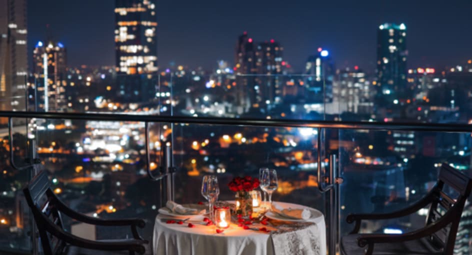 Elegant romantic dinner setup on the rooftop of NH Collection Colombo