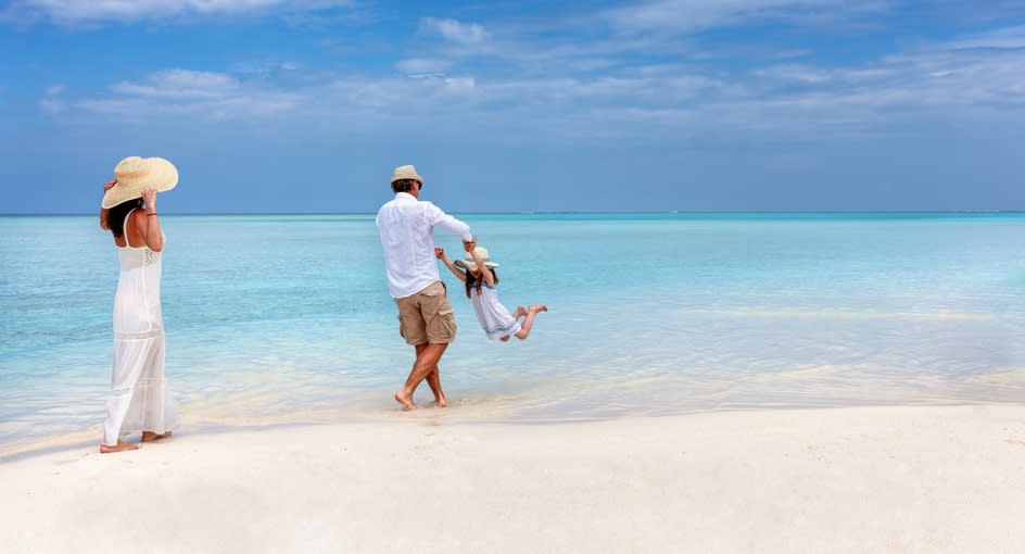 Family enjoying a Maldives beach holiday – Family Getaway offer at NH Collection Maldives Reethi Resort