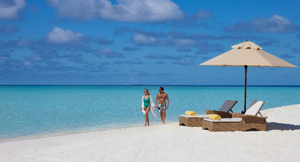 Walking on the beach at NH Maldives Kuda Rah