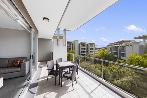 large Bowen Hills Hotels with balcony table and chairs in 2 bedroom apartment at Oaks Mews, Brisbane
