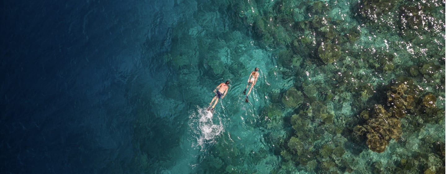 Couple snorkelling at NH Collection Maldives Havodda Resort