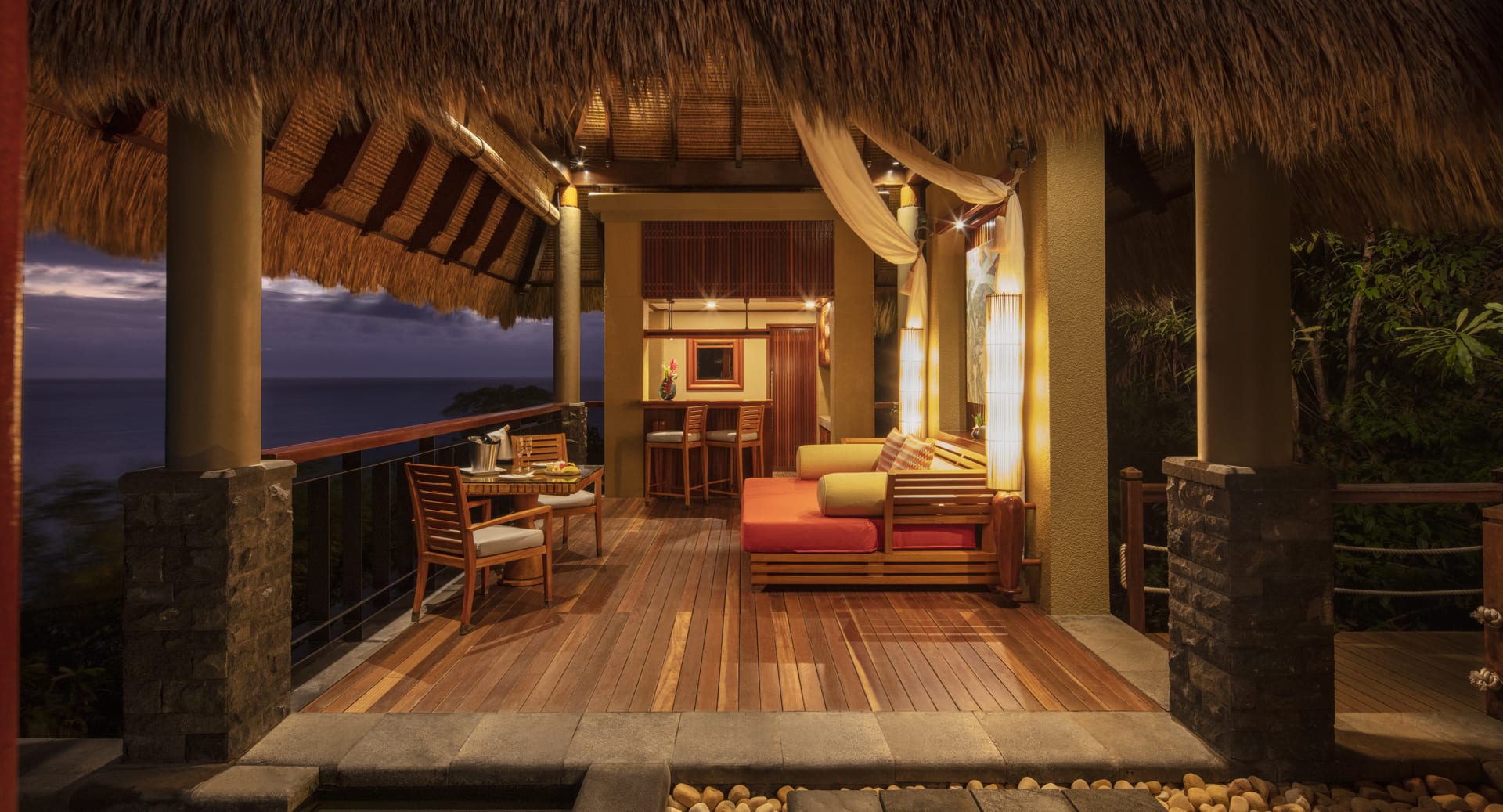 View from daybed of Premier Ocean View Pool Villa evening