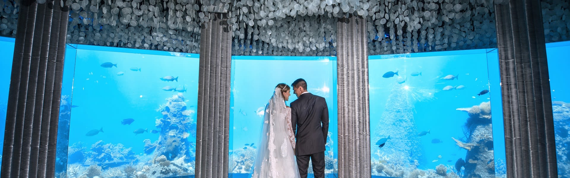 Intimate wedding ceremony in the underwater restaurant at Niyama Private Islands Maldives