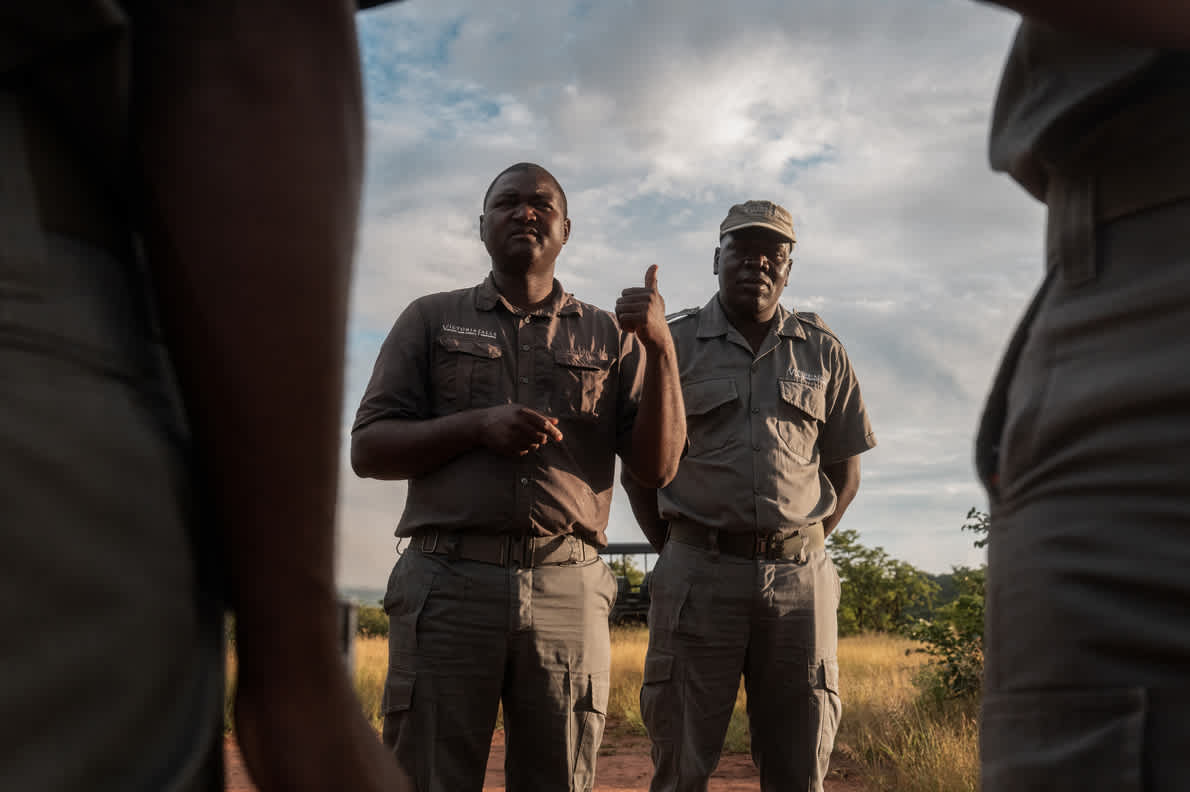 Picket Chabwedzeka, Victoria Falls Private Game Reserve Manager, briefs his Rhino Ranger Patrol unit. 