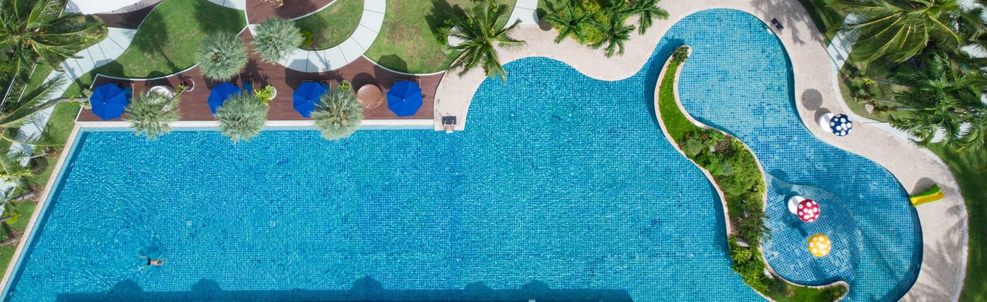 Aerial view of the lagoon-style swimming pool at NH Boat Lagoon Phuket