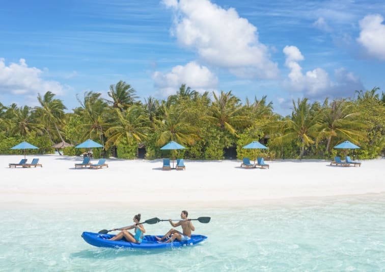 Couple is kayaking at Naladhu Maldives