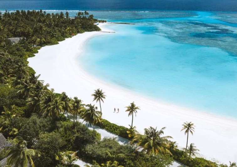 Aerial view of couple walking on the long beach a Niyama Private Islands Maldives