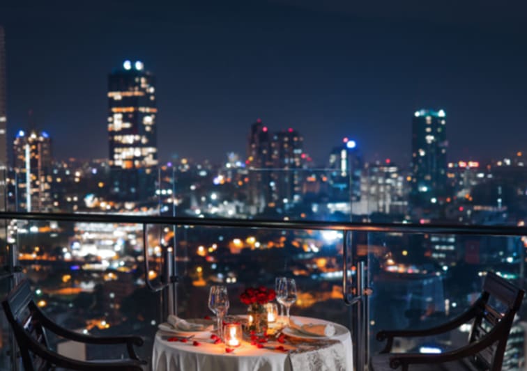 Elegant romantic dinner setup on the rooftop of NH Collection Colombo
