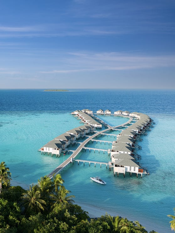 Aerial view of over water villas at NH Collection Maldives Havodda Resort