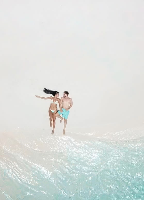 Couple enjoying the secluded beach at Niyama Private Islands Maldives