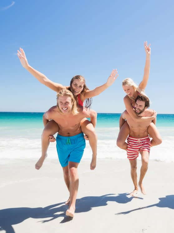 A group of friends enjoying their summer beach holiday at Avani+ Fares Maldives Resort