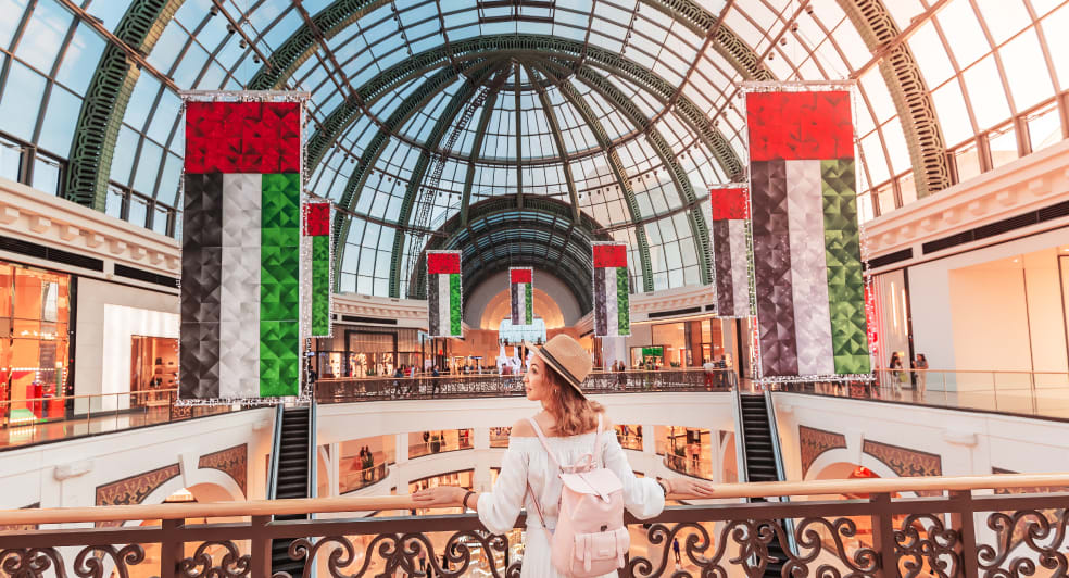 Lady standing infront of glass roof, Dubai Mall near NH Collection Dubai The Palm