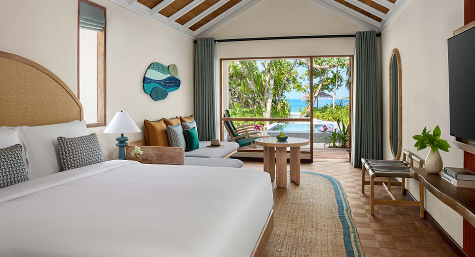 Guest room at NH Collection Maldives Reethi Beach with tropical garden views and contemporary island design
