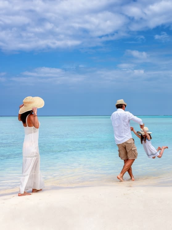 Family enjoying a Maldives beach holiday – Family Getaway offer at NH Collection Maldives Reethi Resort