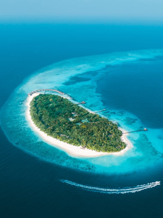 NH Collection Maldives Reethi Resort island with white beaches and coral reefs, now with special opening offer