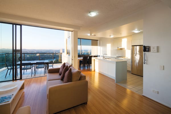 Hotels Brisbane CBD with spacious family friendly living room at Oaks 212 Margaret street hotel in Brisbane city with comfortable furniture and kitchen