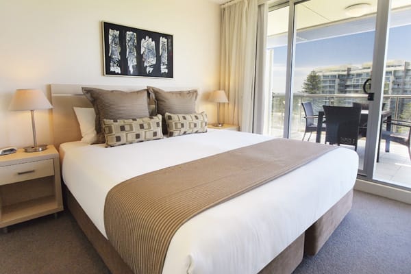Hotels Glenelg with air con and king size bed in 3 Bedroom Apartment with fully furnished private balcony at Oaks Plaza Pier hotel in Glenelg, South Australia
