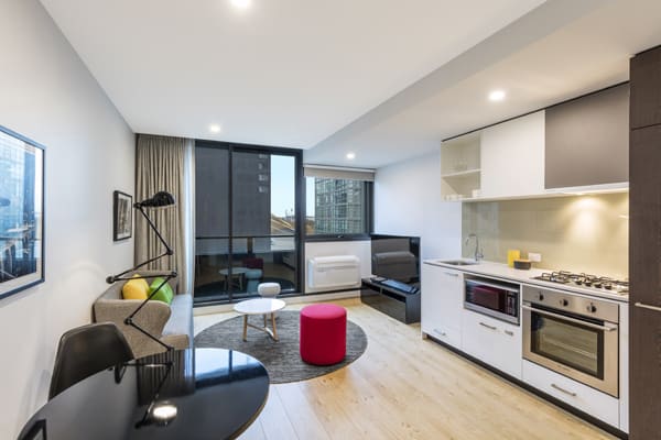 large 1 bedroom apartment in Melbourne city with free Wi-Fi, modern furniture, private balcony outside and kitchenette with microwave and kettle